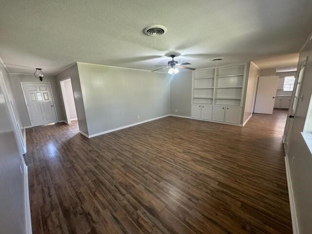 unfurnished living room featuring visible vents, a ceiling fan, a textured ceiling, baseboards, and dark wood-style flooring