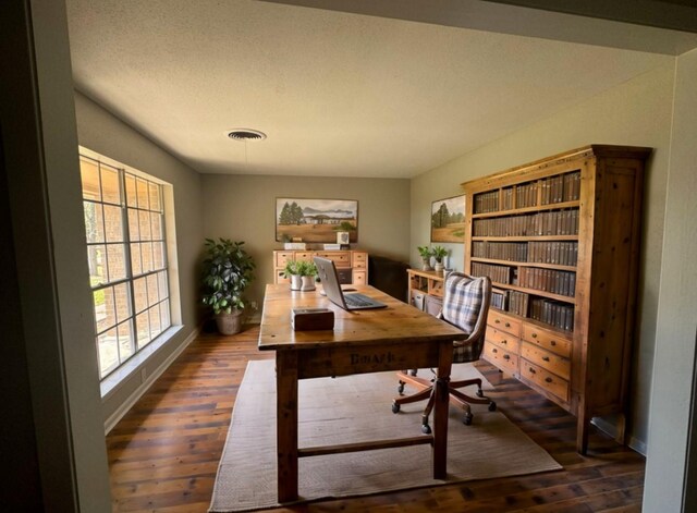 office with dark hardwood / wood-style floors