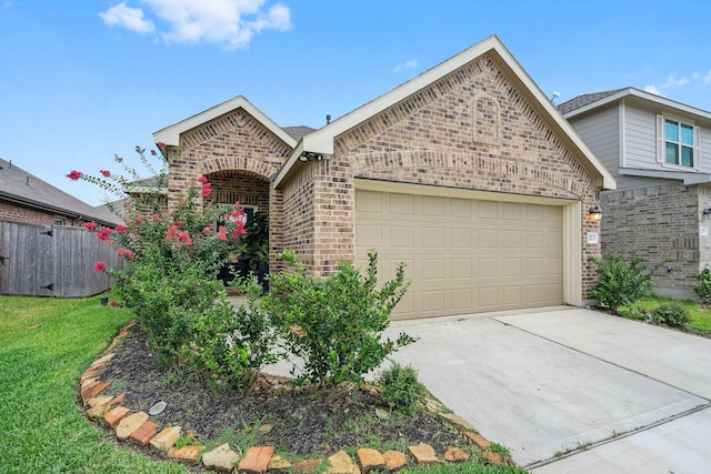 view of front of home with a garage and a front yard