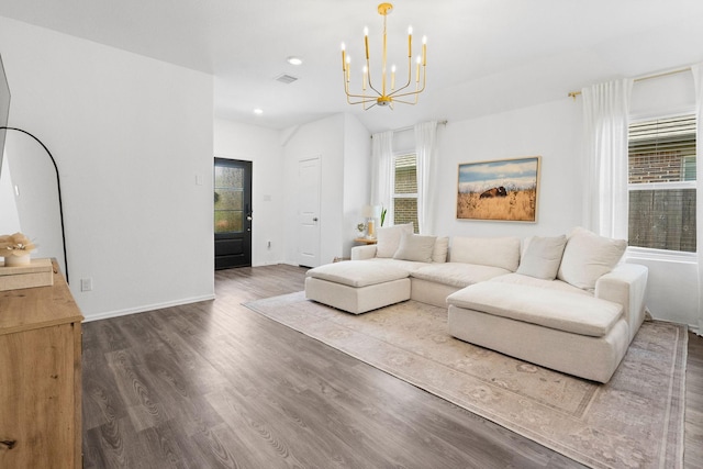 living room featuring dark hardwood / wood-style floors and a notable chandelier