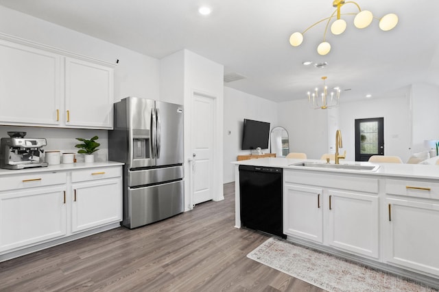 kitchen with decorative light fixtures, white cabinetry, black dishwasher, sink, and stainless steel refrigerator with ice dispenser