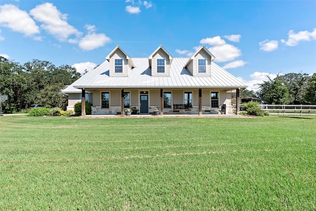 back of property featuring a yard and covered porch