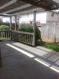 view of patio / terrace with fence and a pergola