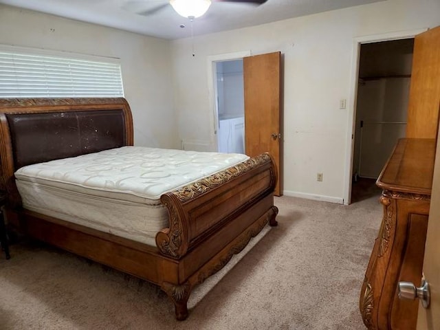 bedroom featuring ceiling fan and light carpet