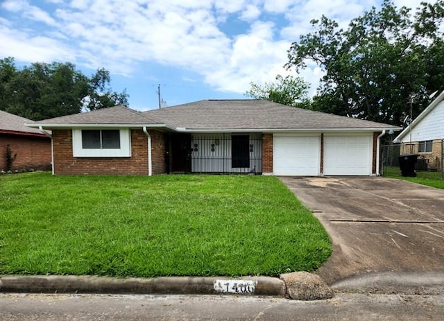 ranch-style home featuring a garage and a front yard