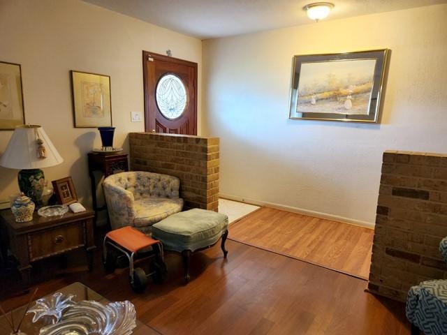 living area with hardwood / wood-style flooring