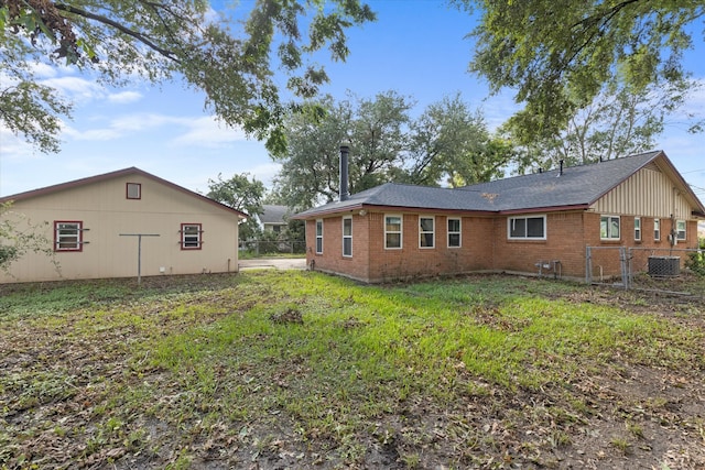 rear view of house featuring cooling unit