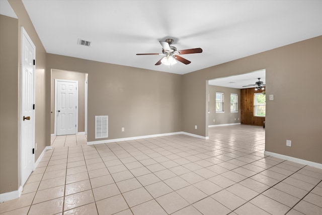 unfurnished room featuring ceiling fan and light tile patterned floors