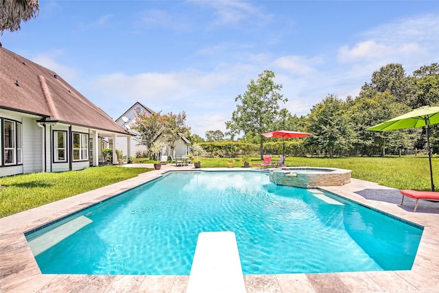 view of swimming pool with a diving board, an in ground hot tub, a patio area, and a lawn