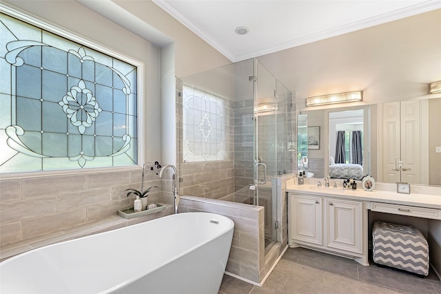 bathroom with tile patterned flooring, shower with separate bathtub, ornamental molding, and vanity