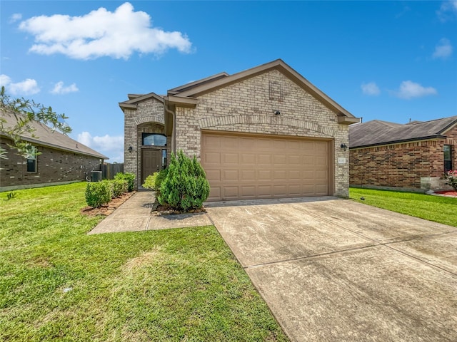 view of front of home with a front lawn and a garage