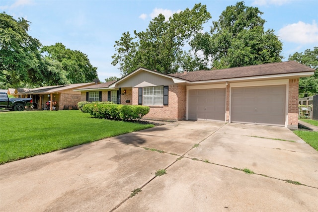 ranch-style house featuring a front lawn and a garage