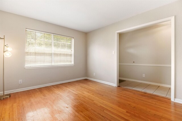 unfurnished bedroom with hardwood / wood-style flooring