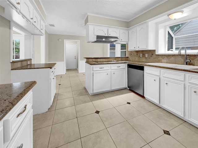 kitchen with dishwasher, white cabinets, dark stone countertops, and sink