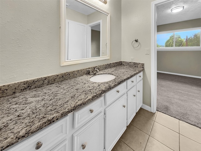 bathroom featuring tile patterned floors and vanity