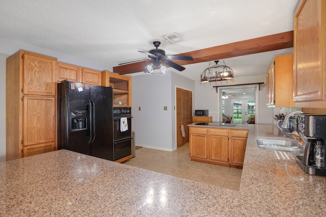 kitchen featuring beamed ceiling, kitchen peninsula, black appliances, and sink