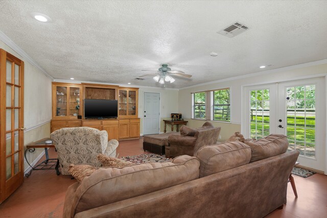 living room featuring french doors, crown molding, a textured ceiling, and ceiling fan