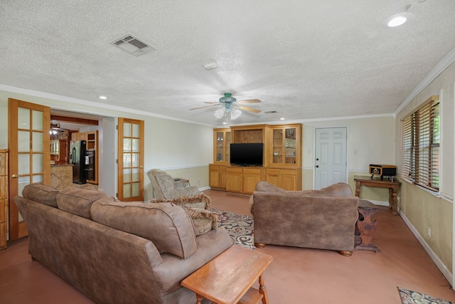 living room featuring ornamental molding, french doors, a textured ceiling, and ceiling fan