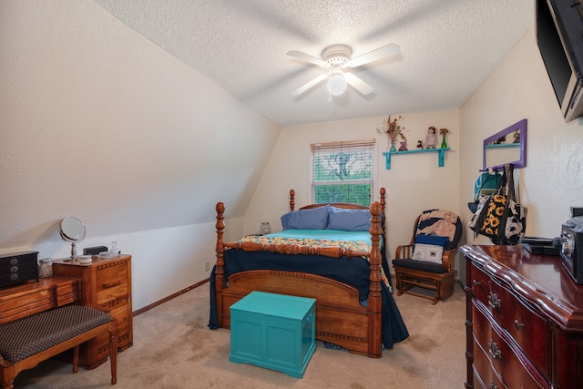 carpeted bedroom with ceiling fan, a textured ceiling, and lofted ceiling