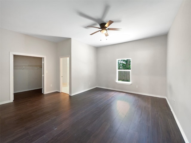 unfurnished bedroom with dark hardwood / wood-style flooring, ceiling fan, and a closet