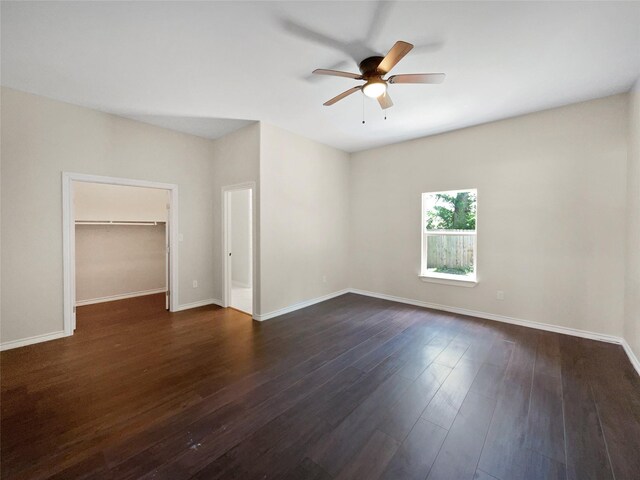 unfurnished room with ceiling fan and dark hardwood / wood-style flooring