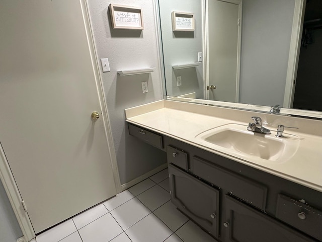 bathroom featuring tile patterned floors and vanity