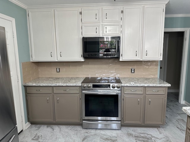 kitchen featuring white cabinetry, gray cabinetry, decorative backsplash, and appliances with stainless steel finishes