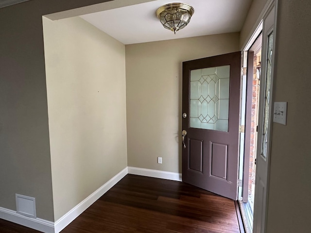 foyer with dark hardwood / wood-style floors