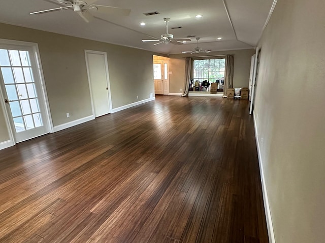 unfurnished living room featuring lofted ceiling, ceiling fan, and dark hardwood / wood-style floors