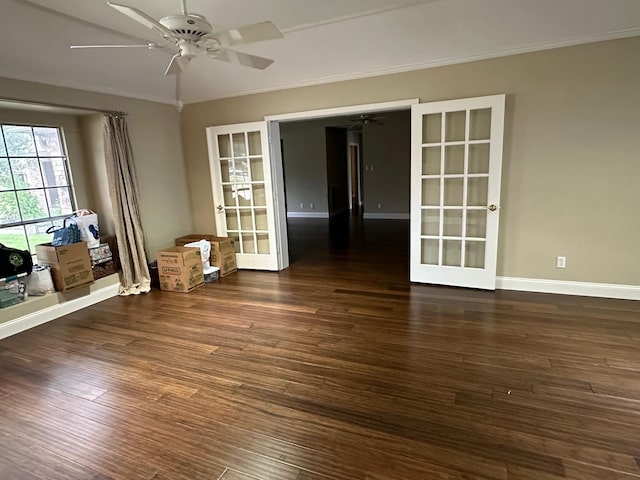 spare room featuring french doors, dark hardwood / wood-style flooring, ceiling fan, and crown molding