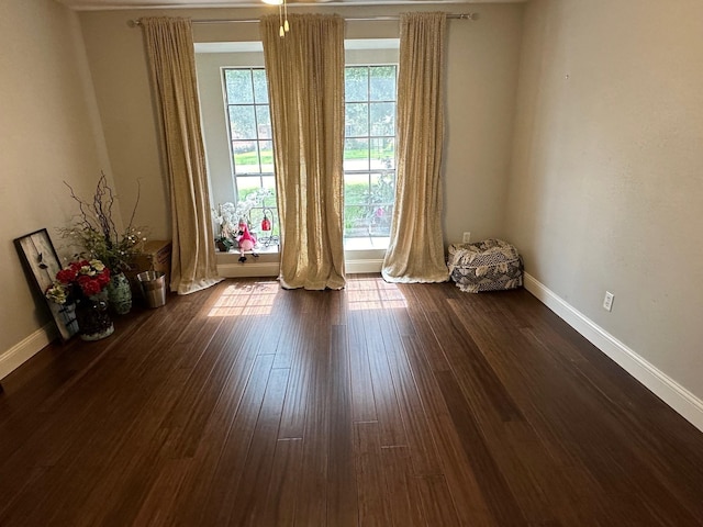 spare room featuring dark hardwood / wood-style floors