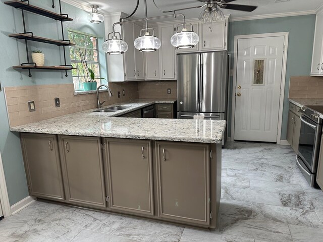 kitchen featuring backsplash, sink, appliances with stainless steel finishes, decorative light fixtures, and kitchen peninsula