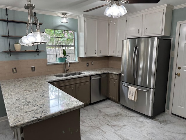 kitchen with white cabinets, appliances with stainless steel finishes, tasteful backsplash, and sink