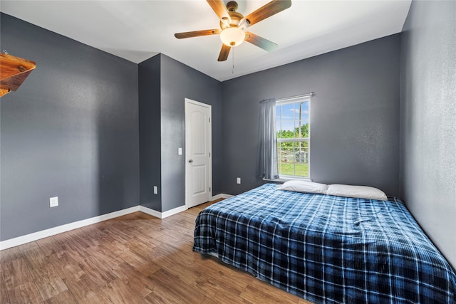 bedroom featuring ceiling fan and hardwood / wood-style floors