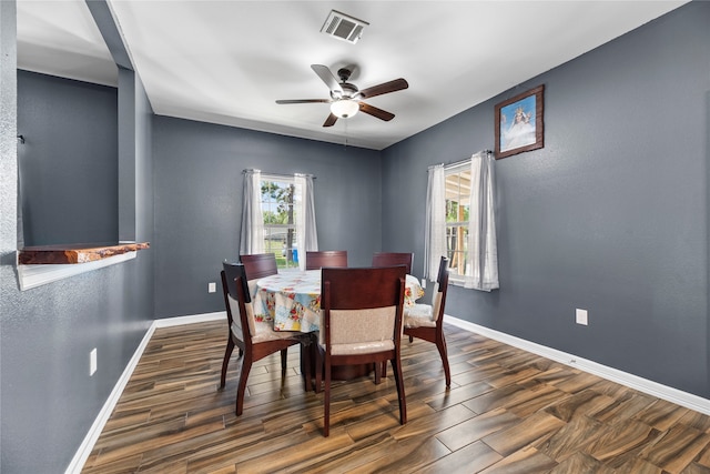 dining room featuring ceiling fan and dark hardwood / wood-style floors