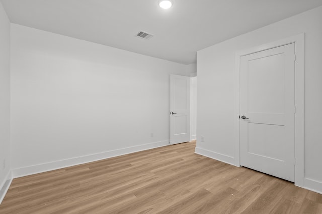 unfurnished bedroom featuring light wood-type flooring