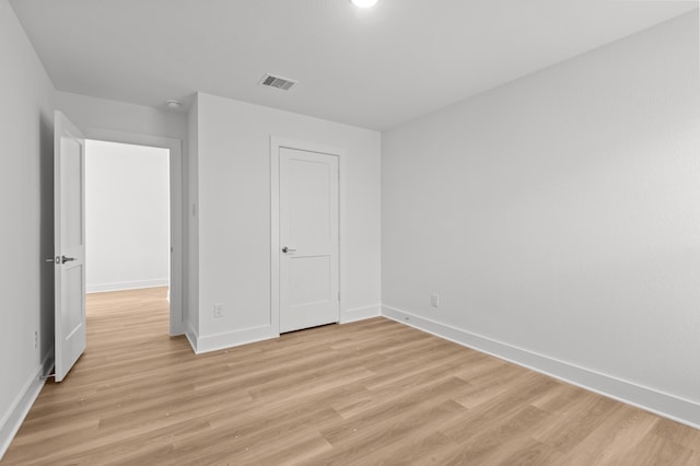 unfurnished bedroom with light wood-type flooring