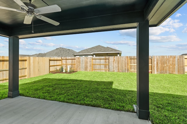 view of yard with a patio and ceiling fan