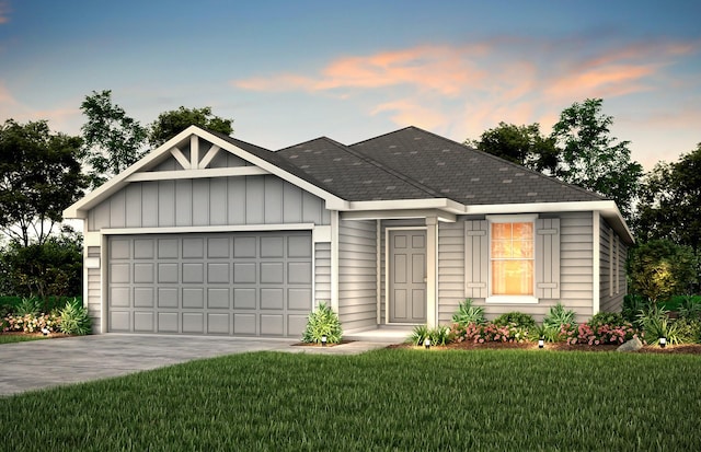 view of front facade with a lawn and a garage