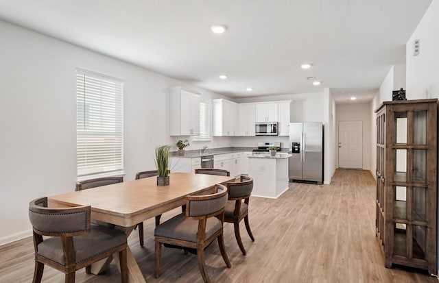 dining room with light hardwood / wood-style flooring