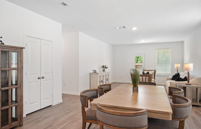 dining space featuring light wood-type flooring