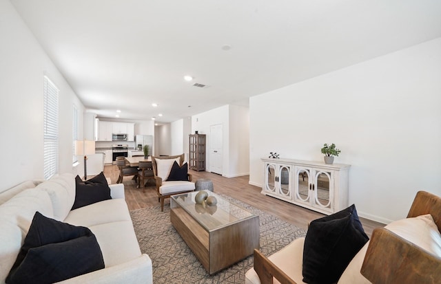 living room with light hardwood / wood-style flooring