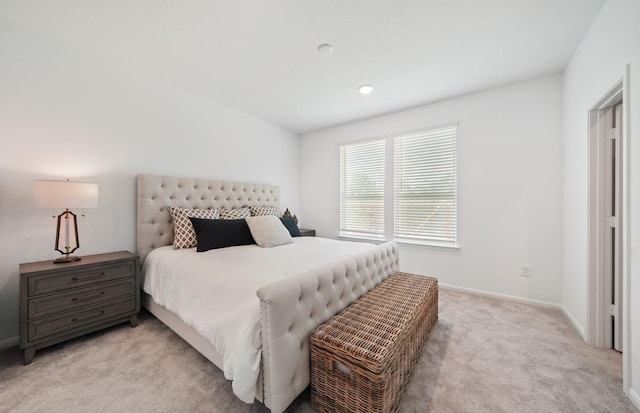 bedroom featuring light carpet