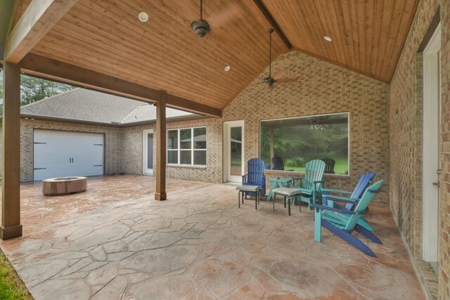 view of patio featuring a garage and ceiling fan