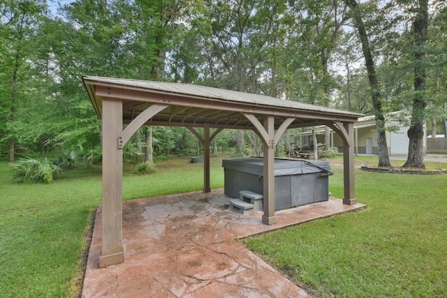 view of terrace with a gazebo and a hot tub