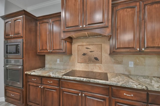 kitchen with appliances with stainless steel finishes, ornamental molding, backsplash, and light stone counters