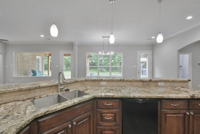 kitchen featuring crown molding, dishwasher, decorative light fixtures, light stone counters, and sink