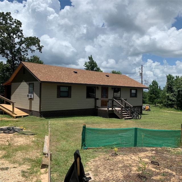 back of house featuring cooling unit and a yard