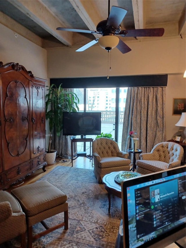 living room with ceiling fan and beamed ceiling