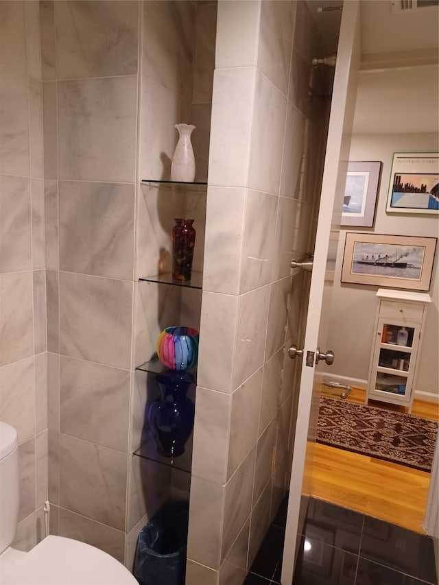 bathroom featuring toilet and hardwood / wood-style flooring